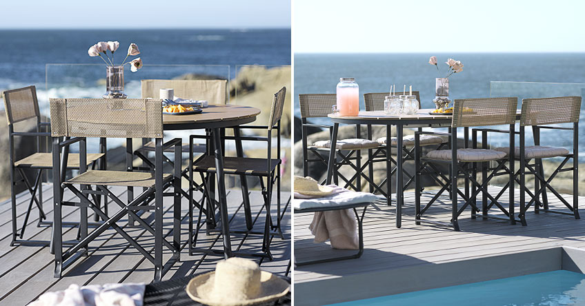 Runder, ausziehbarer Gartentisch auf einer grossen Terrasse am Meer